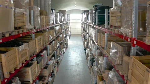 Warehouse or stock of materials, racks, boxes, containers. Shelves with goods or Video stock 147679824