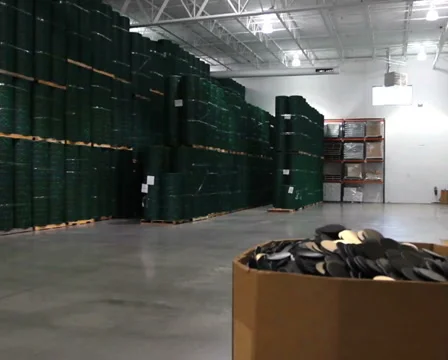 Warehouse Pan to Worker Stock Footage 939447