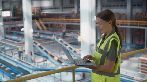 Warehouse Parcel Logistics Operator Using Laptop 動画素材 251705387