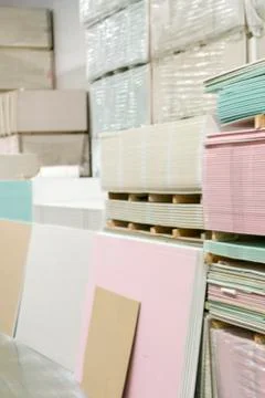 Warehouse with plasterboard. sheets of plasterboard on pallets. Stock Photos