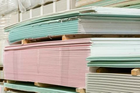 Warehouse with plasterboard. sheets of plasterboard on pallets. Construction  Stock Photos