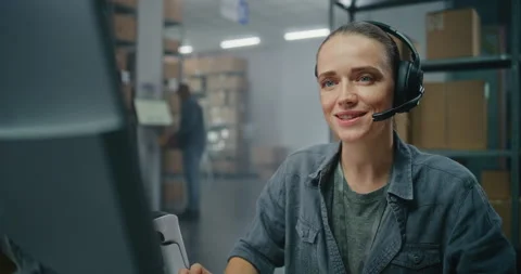 Warehouse of post office: Female customer support specialist in logistics talks Stock Footage 307618691