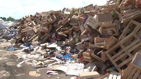 Warehouse for processing waste.Wooden boxes. Mountains of garbage. Stock Footage 55812461