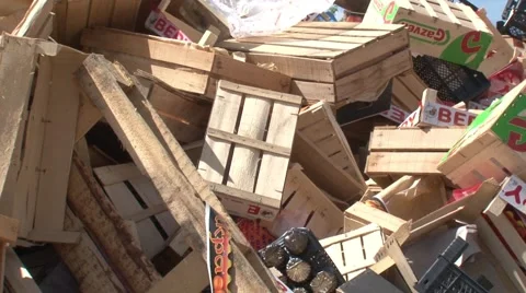 Warehouse for processing waste.Wooden boxes. Mountains of garbage. Stock Footage 55812471