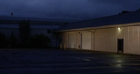 Warehouse on a rainy evening Stock Footage 86767524