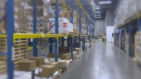 Warehouse with shelves filled with boxes and packages demonstrating organized Video stock 301521036