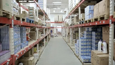 Warehouse shelves with lots of different goods camera movement up Stock Footage 102396770