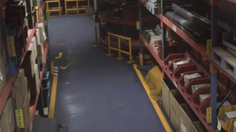 Warehouse with shelves showing various boxes and materials Stock Footage 343572305