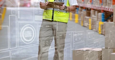 Warehouse staff walking aisle, tapping tablet activating AR overlays, checking Video stock 320896710