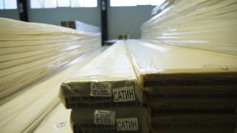 Warehouse storage area filled with stacks of wooden panels Stock Footage 306670061
