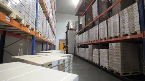 Warehouse storage of goods for distribution to customers, pallets on shelves in  Stock Footage 36840779