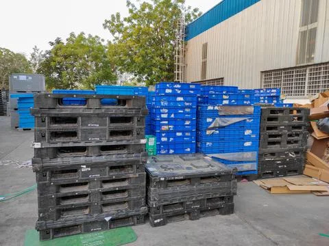 Warehouse storage plastic Pallets Stock Photos