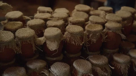 Warehouse store of honey, jam jars and cans with cloth caps. Homemade product Video stock 121278995