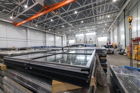 Warehouse storing finished window frames and glass panes 库存照片