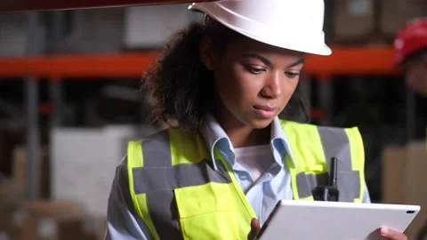 Warehouse supervisor during stocktaking on tablet Stock Footage 161947913