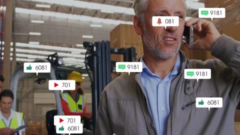 Warehouse supervisor tapping phone and checking notes, sending growing icons Stock Footage 332544607