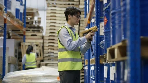 Warehouse supervisors working on pallet racks shipments Stock Footage 80603946