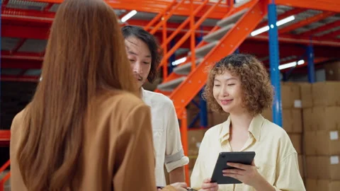 Warehouse Team Collaborating with Tablet. Stock Footage 277738763