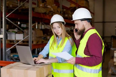 Warehouse Team Using Digital Technology for Inventory Management Stock Photos