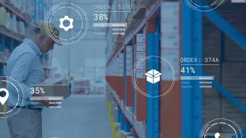 Warehouse tech scanning tablet and pulling box along aisle, showing order Stock Footage 332821956