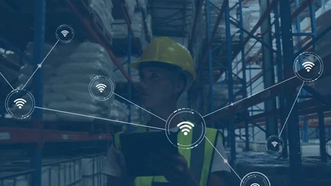Warehouse tech tapping tablet, powering Wi-Fi nodes and HUD rings, network Stock Footage 332804614