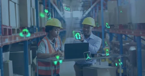 Warehouse tech typing on laptop bringing green AR icons while manager pointing Stock Footage 330444397