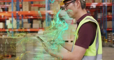 Warehouse technician tapping tablet and revealing swirling AR inventory data Stock Footage 318669053