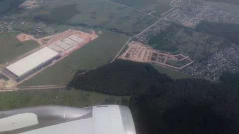 Warehouse view through airplane window Stock Footage 248383316
