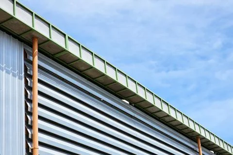 Warehouse Wall with Blue Sky Background. Stock Illustration