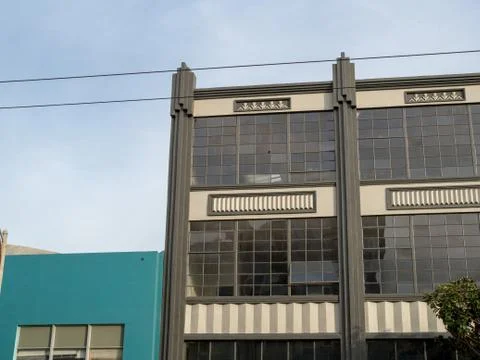 Warehouse windows reflecting setting sun Stock Photos