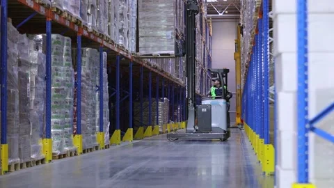 Warehouse work. Workflow in a large warehouse. Special equipment in the Stock-Footage 180033628