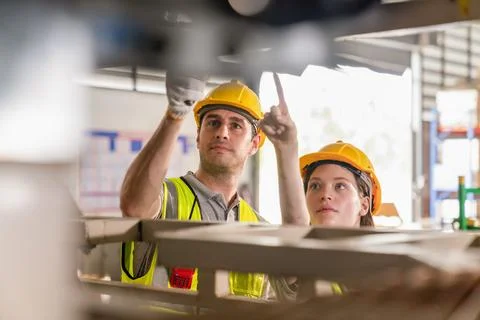 Warehouse worker and managers check stock Stock Photos