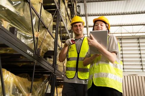 Warehouse worker and managers check stock Stock Photos