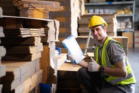 Warehouse worker and managers check stock Stock Photos