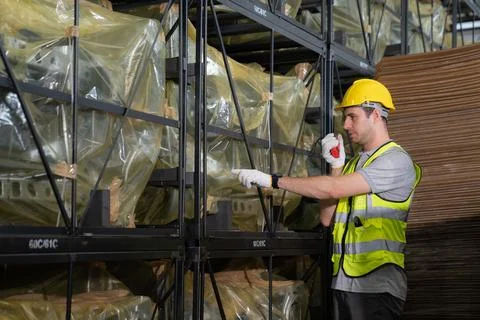 Warehouse worker and managers check stock Stock Photos