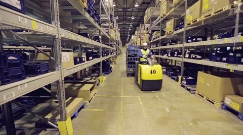 Warehouse worker checking cargo on shelves Stock Footage 61136201