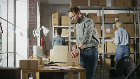 Warehouse Worker Closing Parcel Stock Footage 218420163