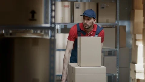 Warehouse Worker Collects Order by Taking Cardboard Boxes and Parcels of Shelf 動画素材 96142473