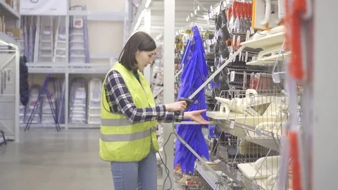 Warehouse worker conducts accounting with barcode scanner Stock Footage 100767821