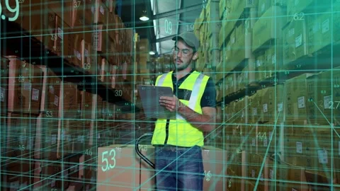 Warehouse worker consulting tablet showing 3D HUD scanning boxes, marking Stock Footage 333396700
