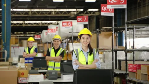 Warehouse worker in distribution center in packing point confidently standing Stock Footage 223380841