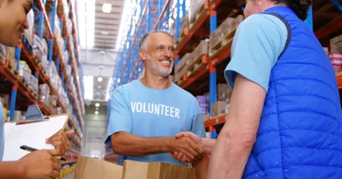 Warehouse worker doing a charitable work Stock Footage 64414543