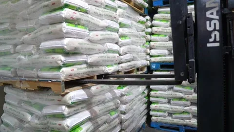 Warehouse worker driver in loading by forklift stack pallet loader Stock Footage 207613190