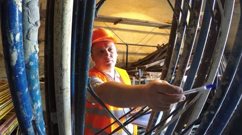 Warehouse worker finds elements of scaffolding. Stock Footage 51547753