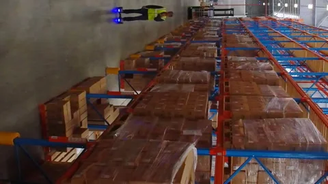 Warehouse worker on hoverboard at warehouse Stock Footage 301498862