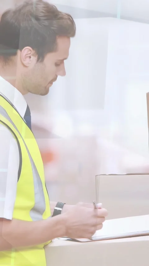 Warehouse worker leaning and placing clipboard on stacked boxes, writing and Stock Footage 332687240