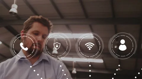 Warehouse worker lifting box, animated logistics icons hovering around box and Stock Footage 334202598