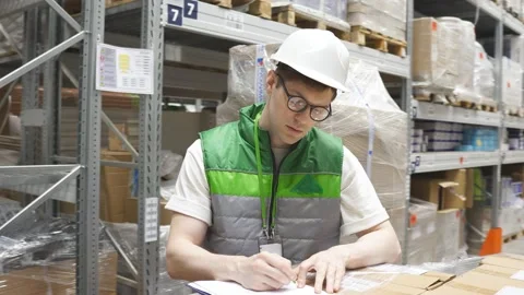 Warehouse worker with list checking stock condition Stock Footage 140225006