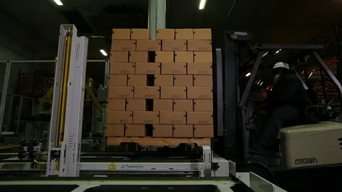 Warehouse worker. Moving palette of boxes with forklift B Video stock 102185808