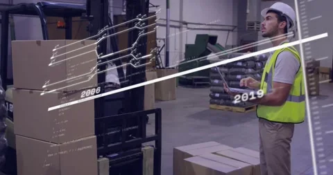 Warehouse worker near forklift tracking box inventory on laptop data overlay Stock Footage 319782875